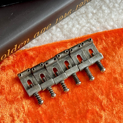 Genuine Fender® • Pat Pend Strat® Saddles